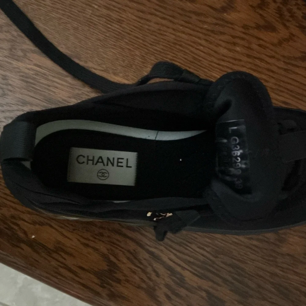 CHANEL Black Women’s Sneakers with Gold Logo